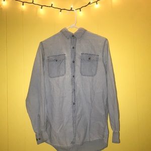 This is a blue button up men’s/boys shirt.